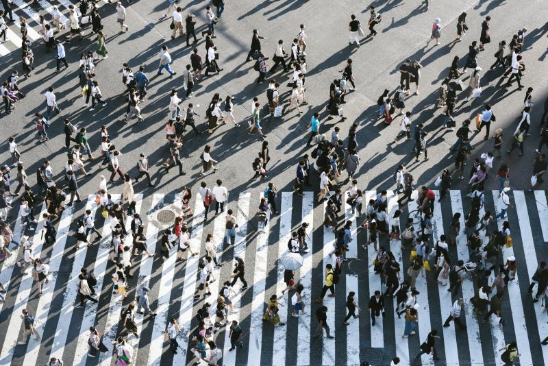 People Pass Through the Shibuya Crossing in Tokyo in June