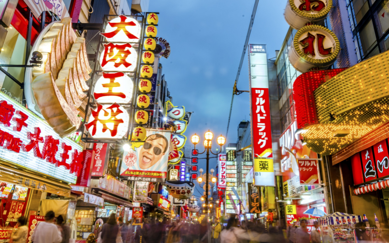 Dotonbori dazzles with neon lights and lively street vibes at night.