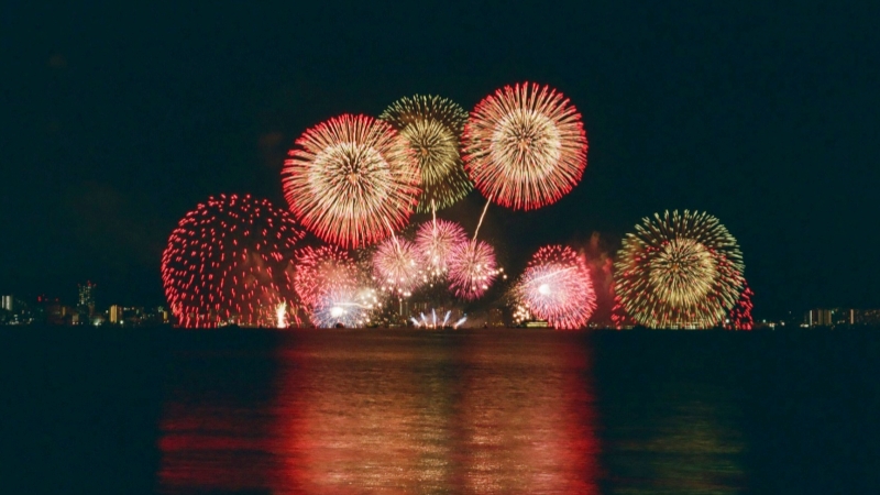 Brilliant fireworks light up the night sky during a Japan summer festival.