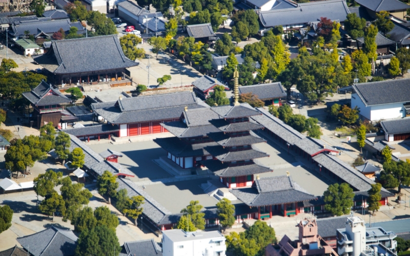 Shitenno-ji Temple reveals its elegant symmetry and timeless beauty, standing serenely amidst the modern cityscape of Osaka.