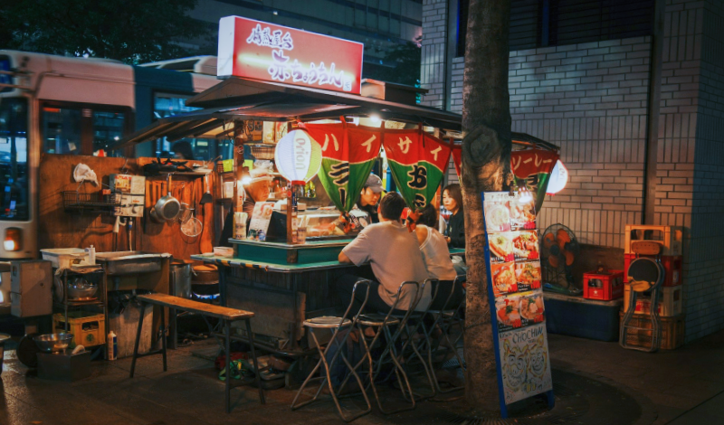 A chilled slice of Fukuoka nightlife unfolds at a cosy yatai food stall.