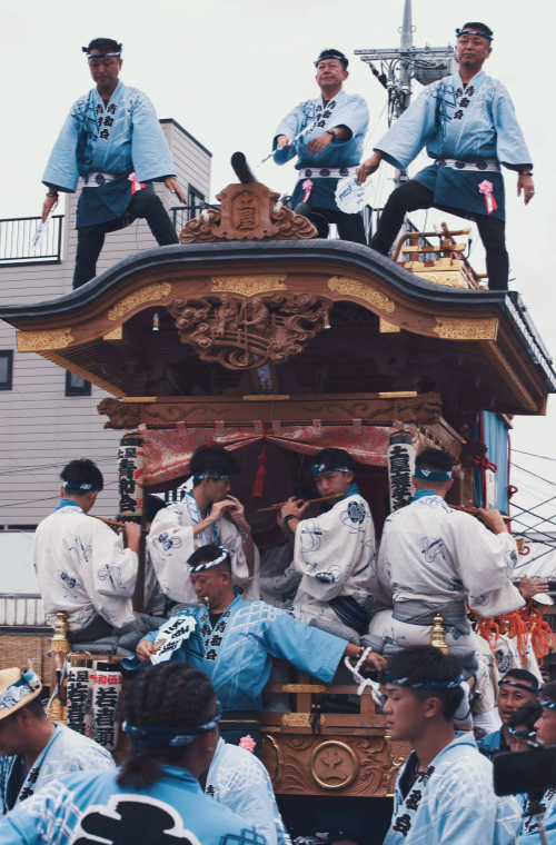 A Japanese float festival showcases ornate wooden floats, traditional music, and strong community spirit.