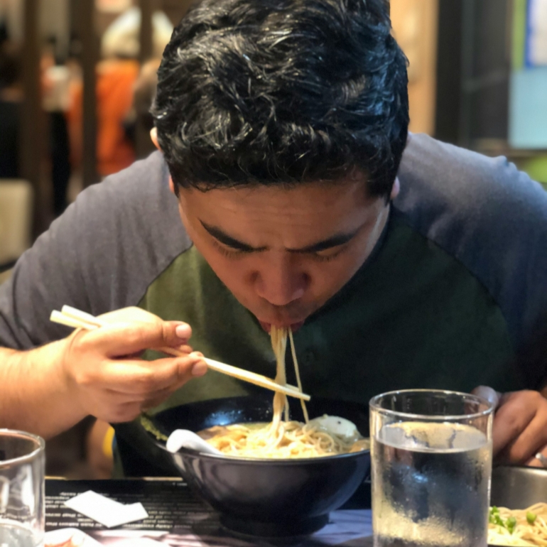 A diner is slurping noodles