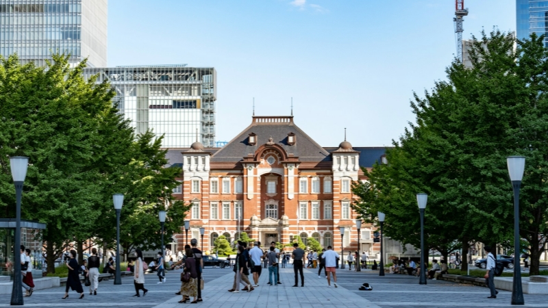 The iconic red-brick facade of Tokyo Station basks in the warm June sunshine.