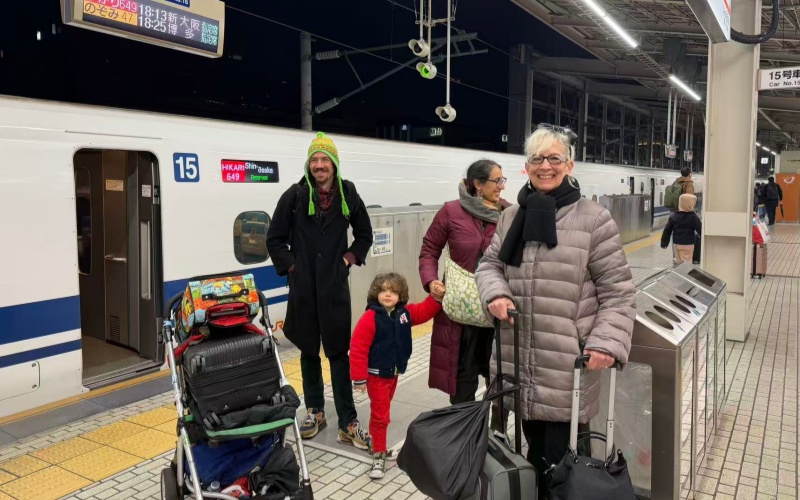 Family with Stroller on Shinkansen Platform in Tokyo