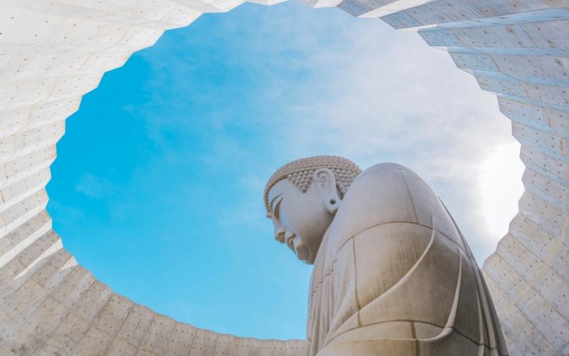 Tadao Ando’s Hill of the Buddha reveals a serene statue framed by minimalist concrete and open sky