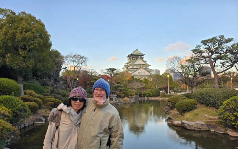 Warm Smiles in Winter: Senior Couple at Osaka Castle