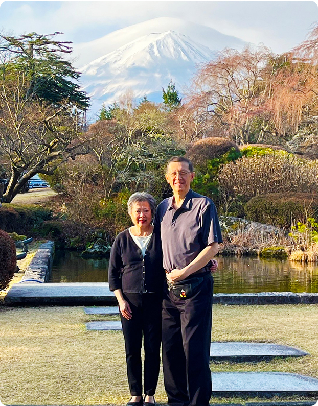 Frank M and his spouse captured with Mt. Fuji in the background during their private Japan cherry blossom journey with UME Travel.