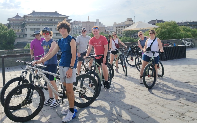 Family Enjoying a Bike Ride Along the Ancient Xi'an City Wall in China