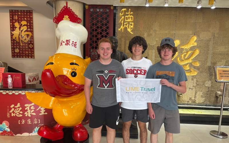 UME Travel’s Young Guests Enjoying Peking Duck at the Iconic Quanjude Restaurant