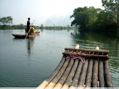 Take a scenic bamboo rafting adventure along the Yulong River