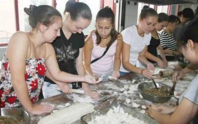 Learning to Make Dumplings at the Invitation of Locals